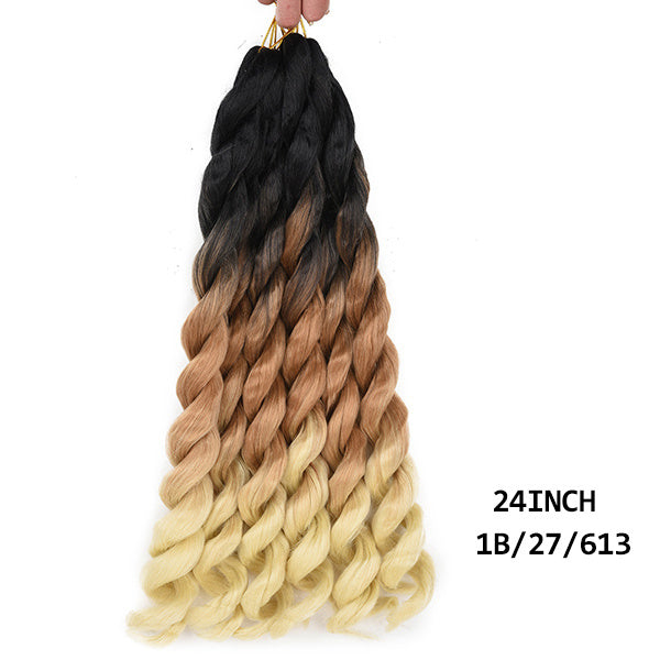 Mèches crochet Dirty Braid bouclées et volumineuses.